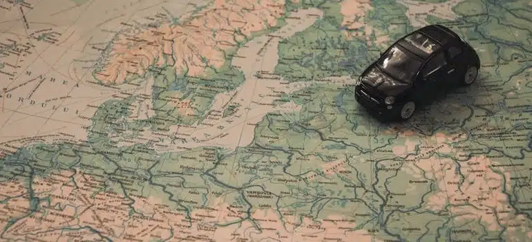 Black Toy Car on a World Map
